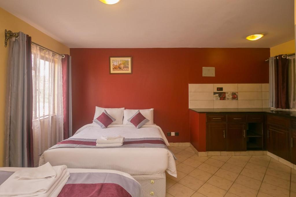 Postel nebo postele na pokoji v ubytování Plus254 Hotel
