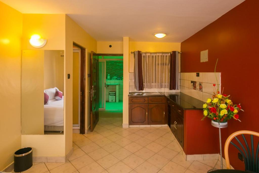 Postel nebo postele na pokoji v ubytování Plus254 Hotel
