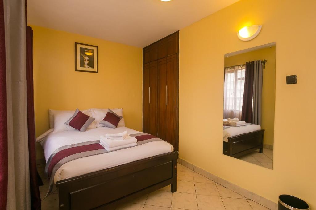 Postel nebo postele na pokoji v ubytování Plus254 Hotel