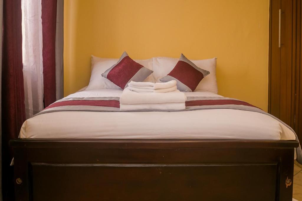 Postel nebo postele na pokoji v ubytování Plus254 Hotel