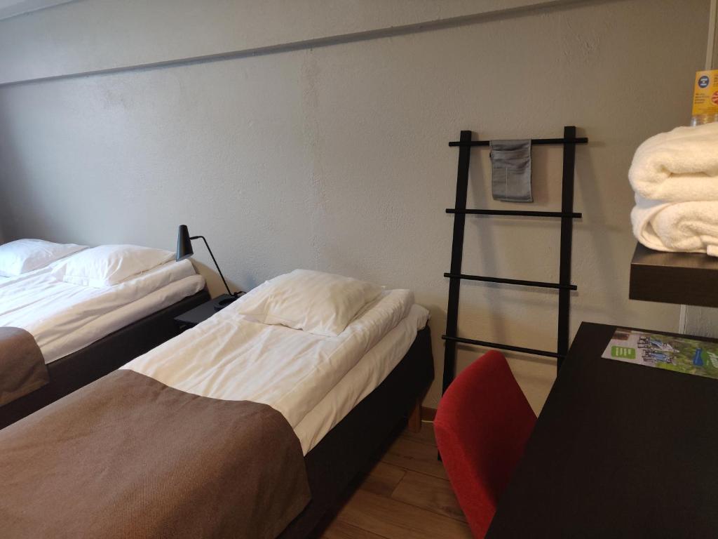 Postel nebo postele na pokoji v ubytování HOSTEL TOIVOLA