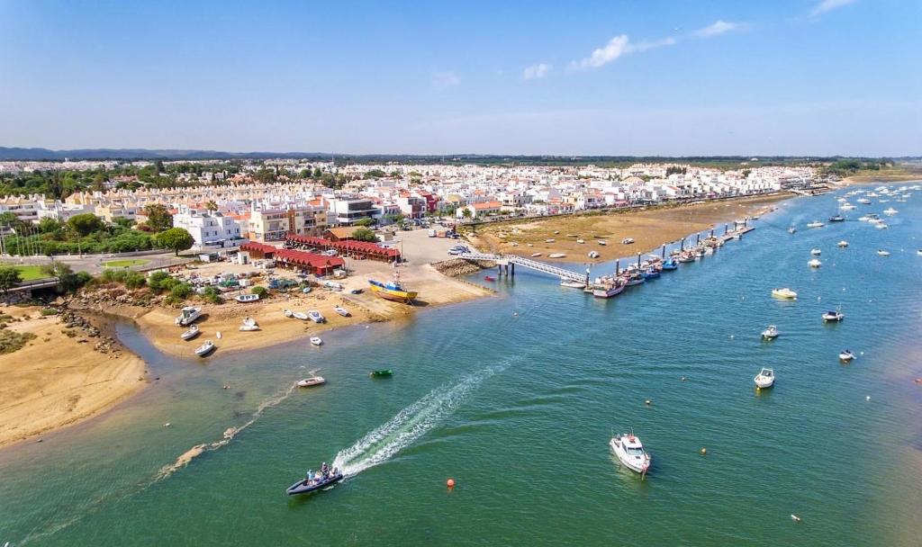 an aerial view of a beach with boats in the water at Ria Formosa Beach Apartment in Cabanas de Tavira