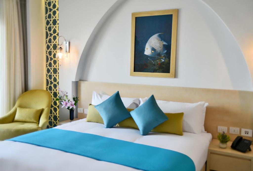 Postel nebo postele na pokoji v ubytování Hotelux La Playa Alamein