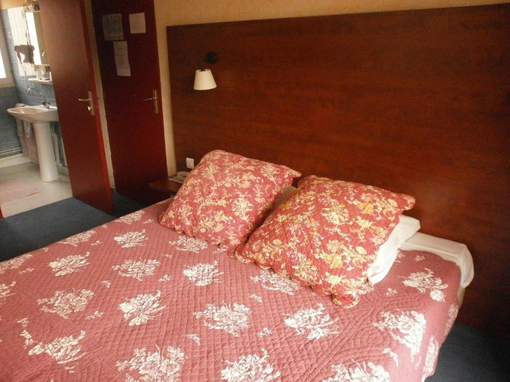 Postel nebo postele na pokoji v ubytování Hôtel Maya