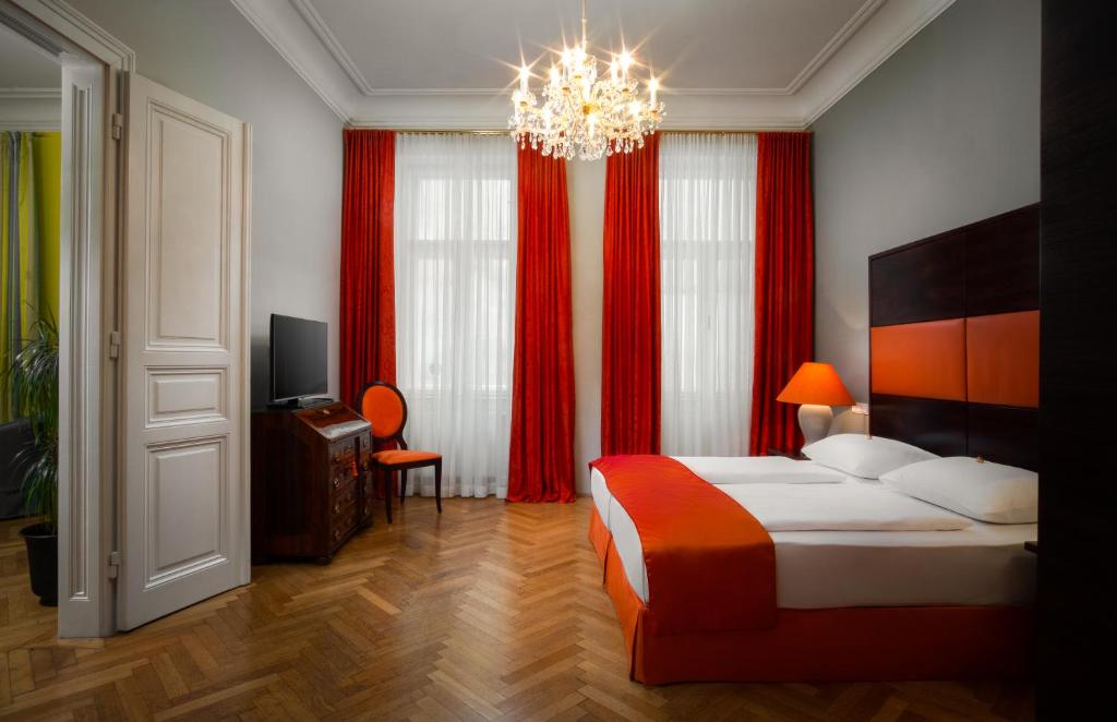 Postel nebo postele na pokoji v ubytování Appartement-Hotel an der Riemergasse