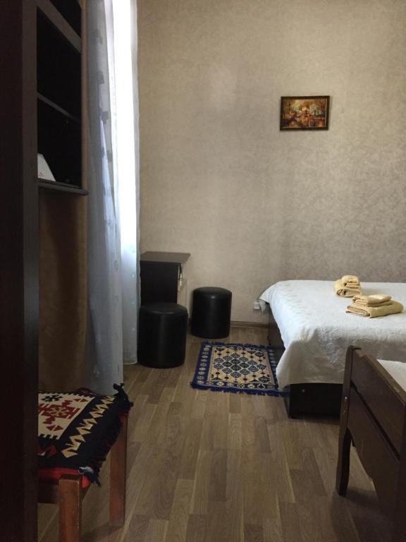 Postel nebo postele na pokoji v ubytování Guest House Loza