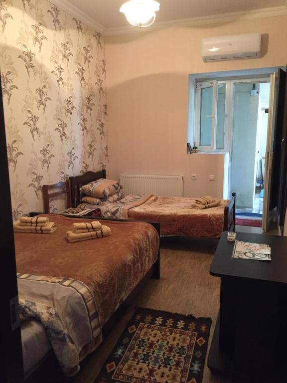 Postel nebo postele na pokoji v ubytování Guest House Loza