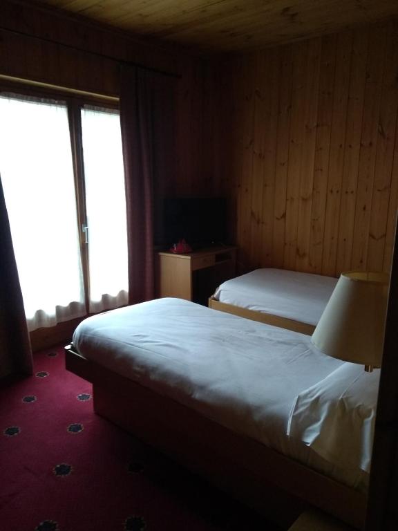 Postel nebo postele na pokoji v ubytování Hotel Derby