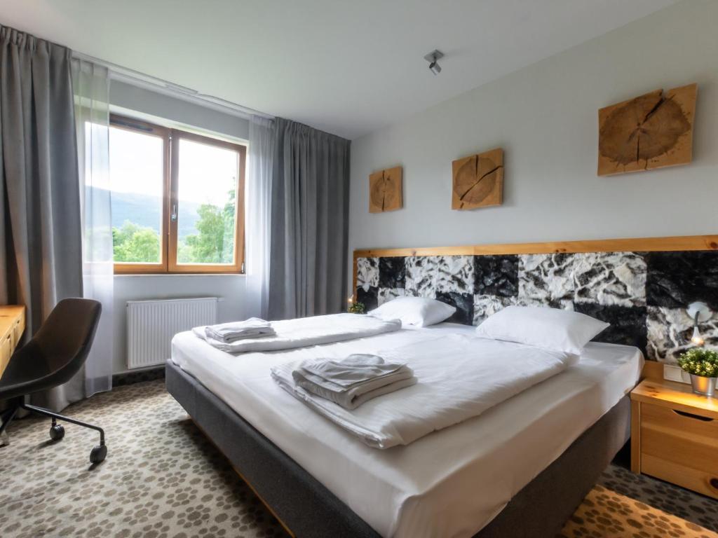 Posteľ alebo postele v izbe v ubytovaní VacationClub – Cristal Resort Apartament 414
