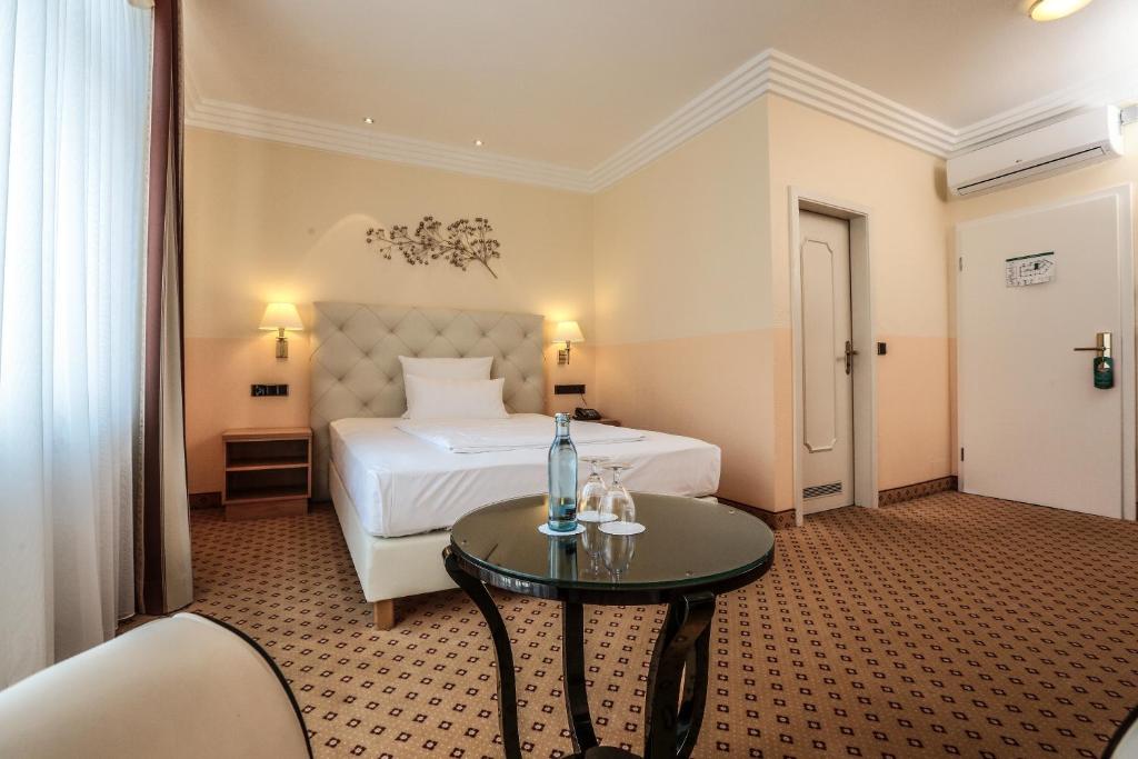 Postel nebo postele na pokoji v ubytování Hotel Mack Private Inn