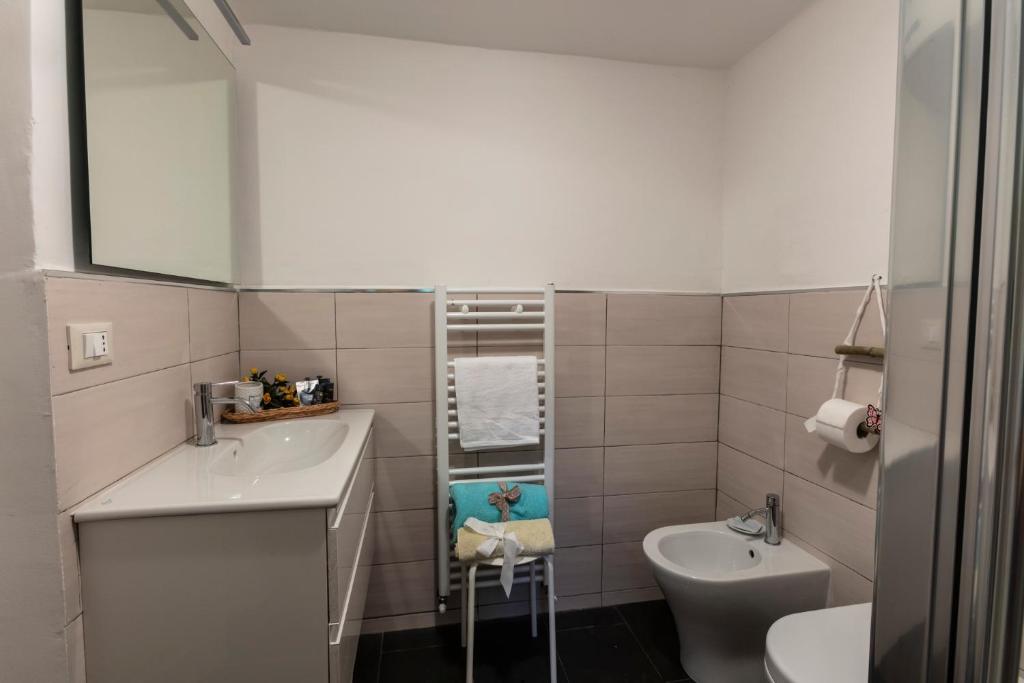 a small bathroom with a sink and a toilet at La BRIGNA B&B Il bosco sul mare in Genoa