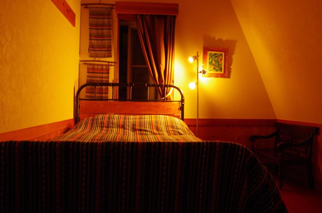 Postel nebo postele na pokoji v ubytování Resort Garni CORU