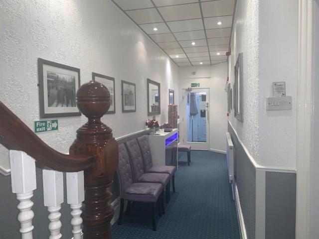 a hospital hallway with chairs and a waiting room at The Mornington Hotel in Blackpool