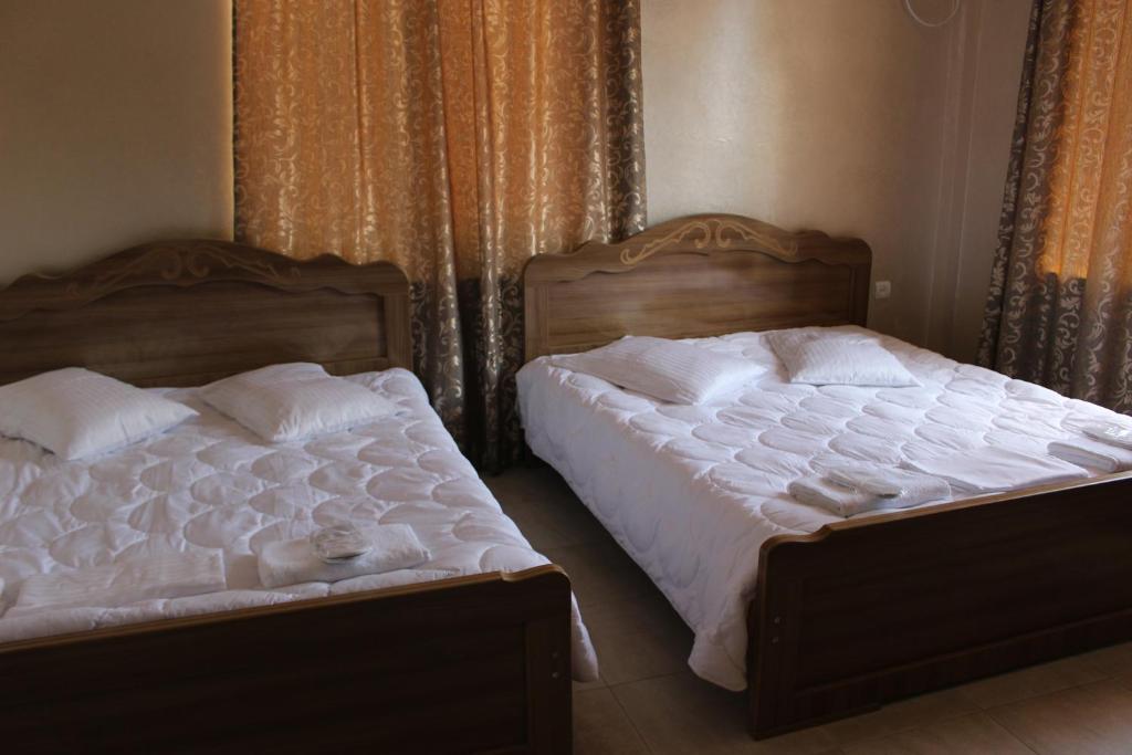 Postel nebo postele na pokoji v ubytování Hotel Evrazia