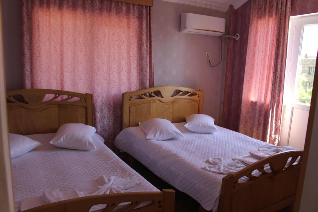 Postel nebo postele na pokoji v ubytování Hotel Evrazia