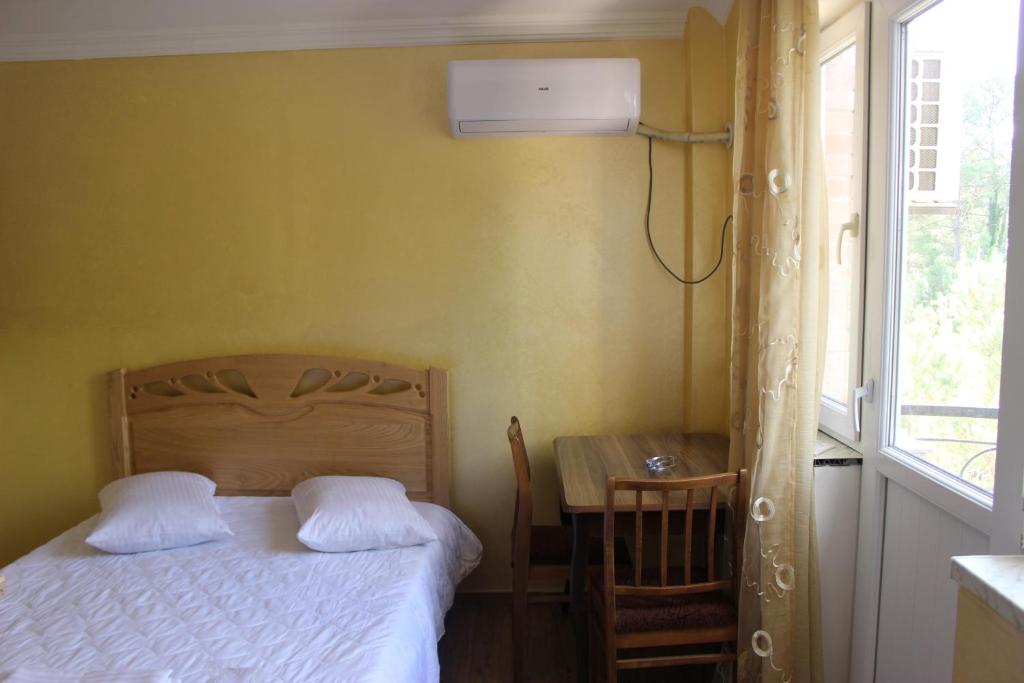 Postel nebo postele na pokoji v ubytování Hotel Evrazia