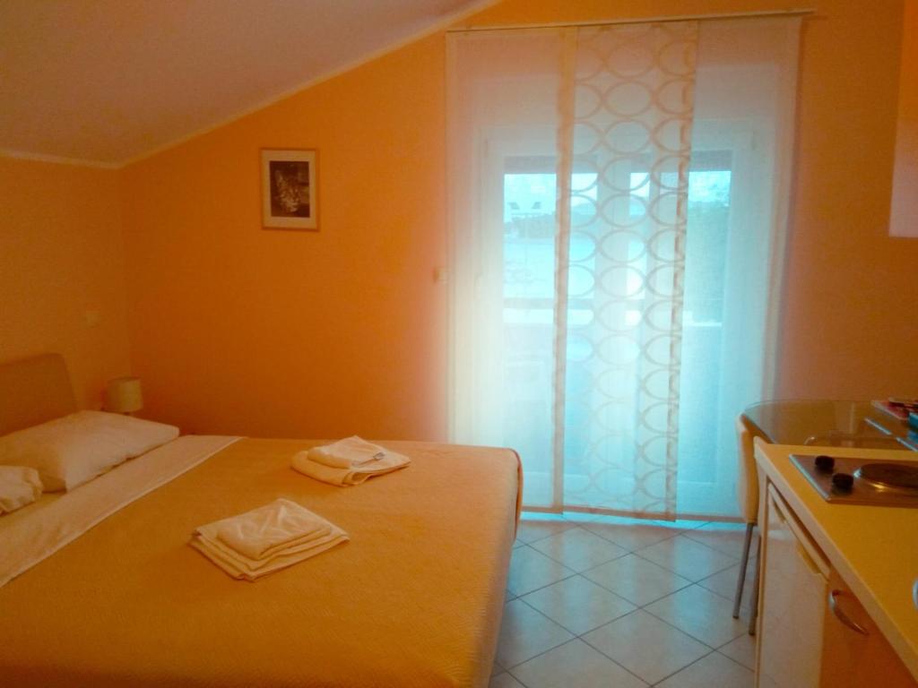 Postel nebo postele na pokoji v ubytování ApartHotel Viola