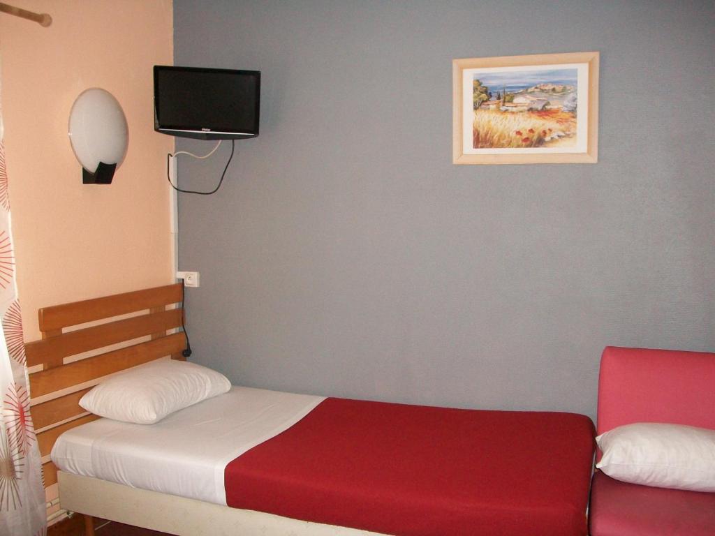 Postel nebo postele na pokoji v ubytování Hotel L'Aiglon