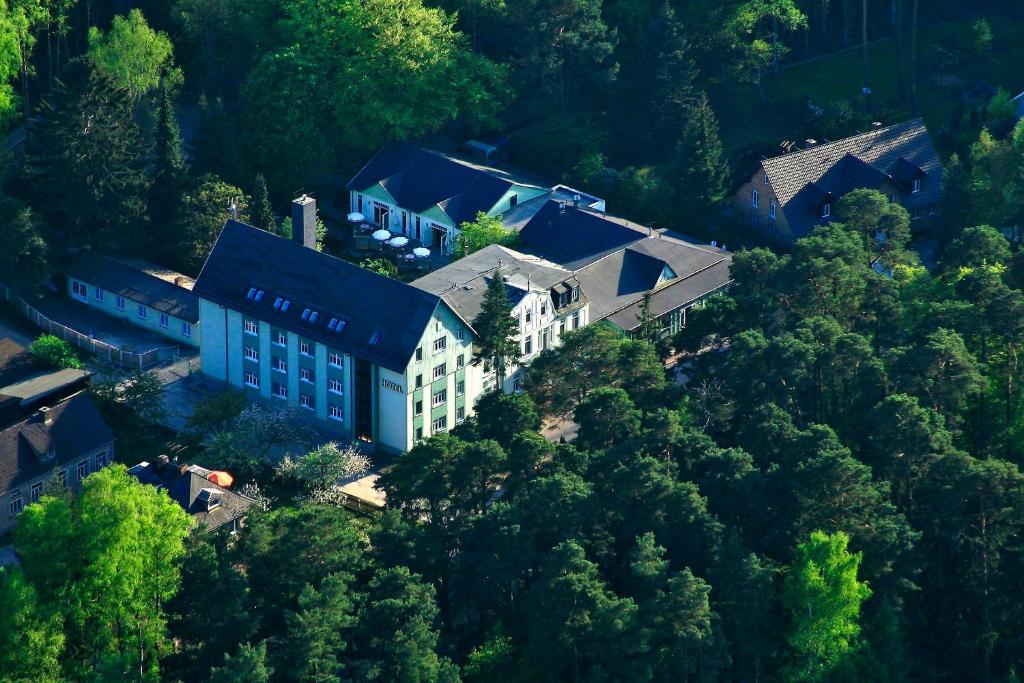 an overhead view of a large building in the trees at Seehotel Ecktannen in Waren