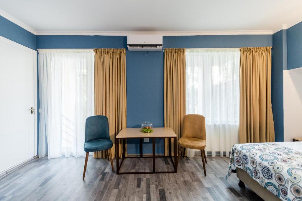 Postel nebo postele na pokoji v ubytování Gvino Minda