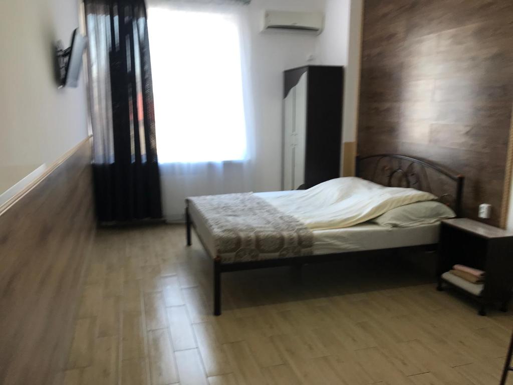 Postel nebo postele na pokoji v ubytování Apartments on Panteleimonovskaya