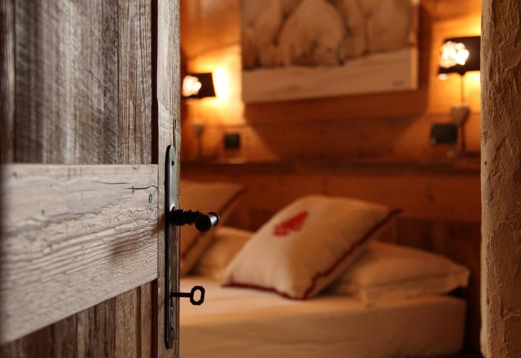 Postel nebo postele na pokoji v ubytování Les Trompeurs chez Odette