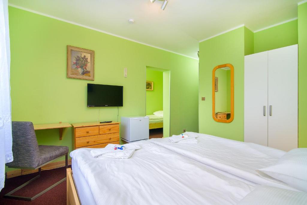 Postel nebo postele na pokoji v ubytování Hotel Max