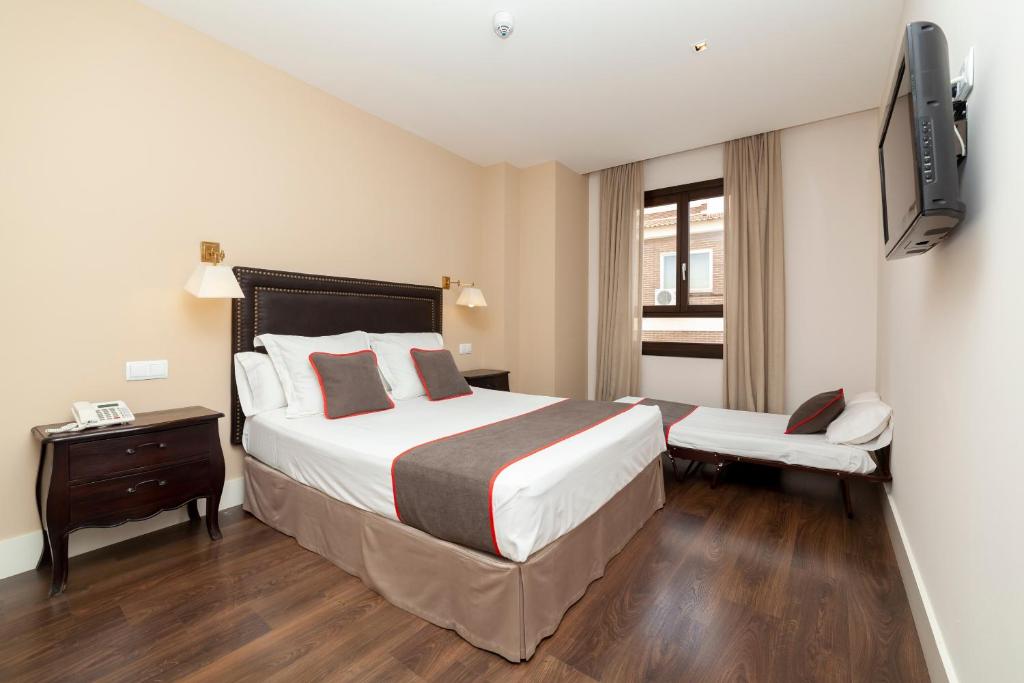 Posteľ alebo postele v izbe v ubytovaní Hotel Altora