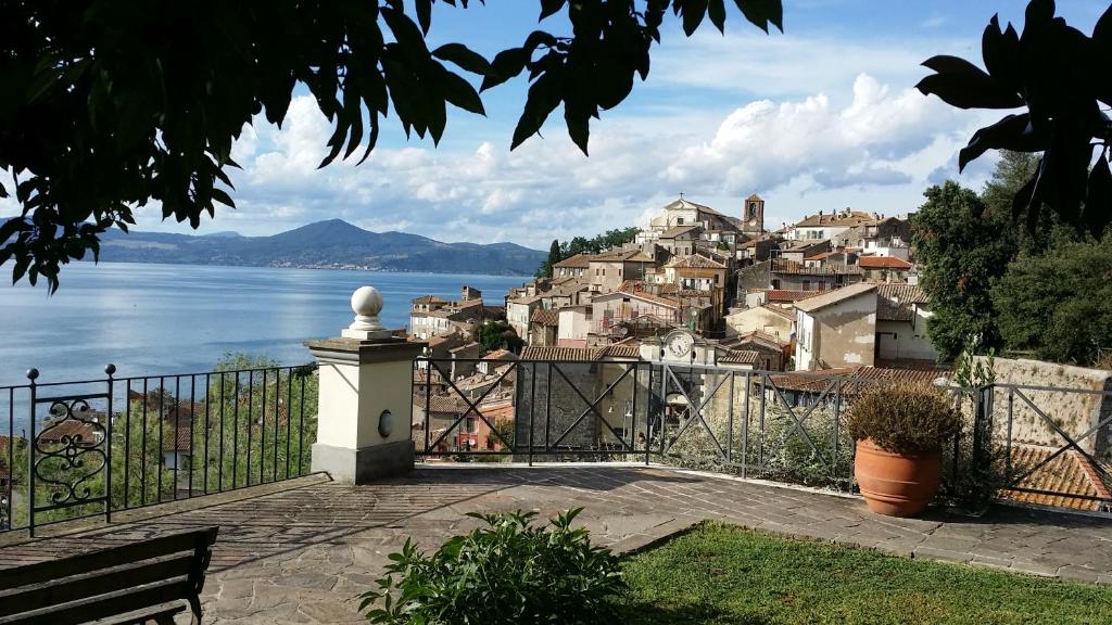 a view of a town on the shore of a body of water at La Villa di Augusto in Anguillara Sabazia