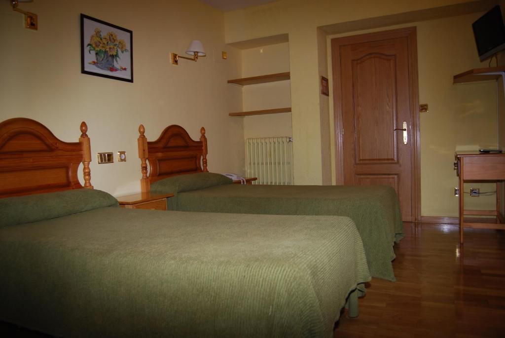 Postel nebo postele na pokoji v ubytování Hotel A Nieu