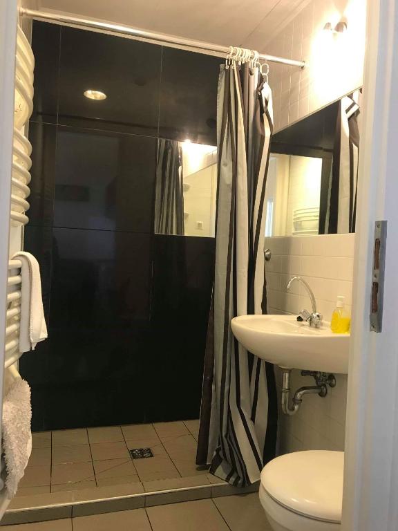 Kúpeľňa v ubytovaní Gyulai Meseház Apartman
