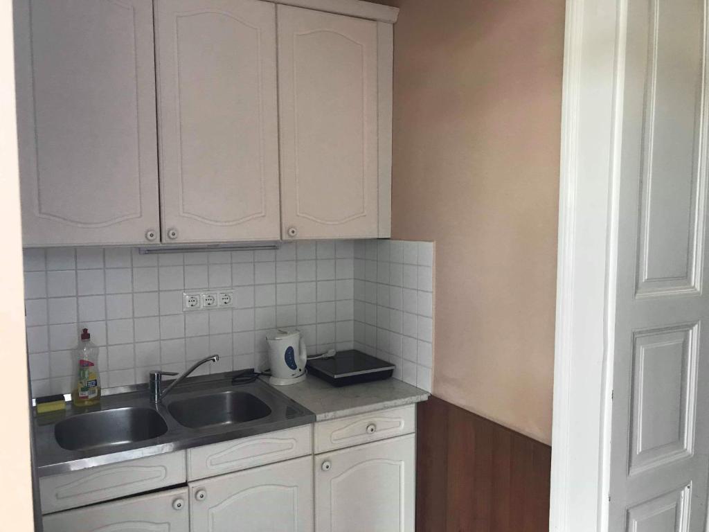 Kuchyňa alebo kuchynka v ubytovaní Gyulai Meseház Apartman