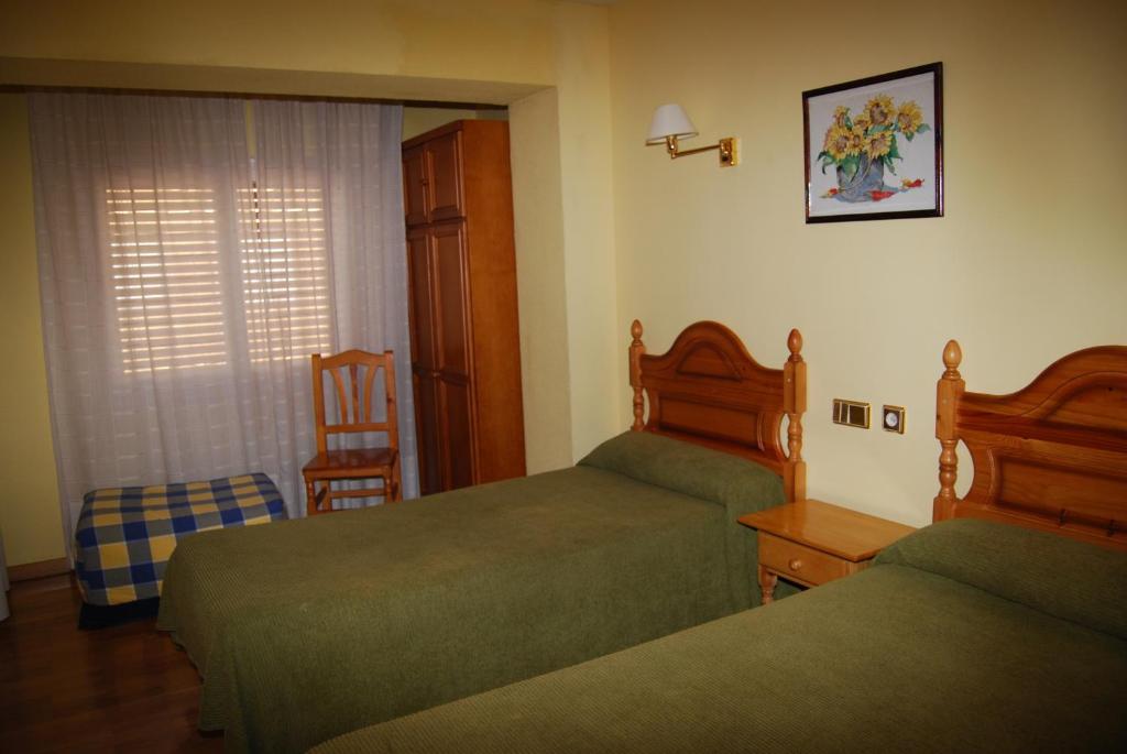 Postel nebo postele na pokoji v ubytování Hotel A Nieu