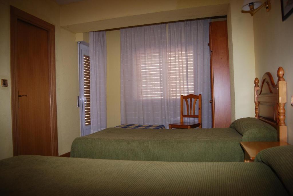 Postel nebo postele na pokoji v ubytování Hotel A Nieu