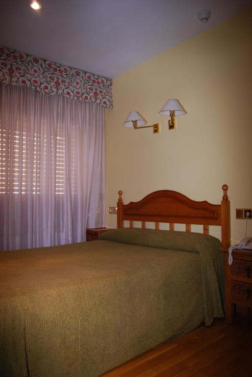 Postel nebo postele na pokoji v ubytování Hotel A Nieu
