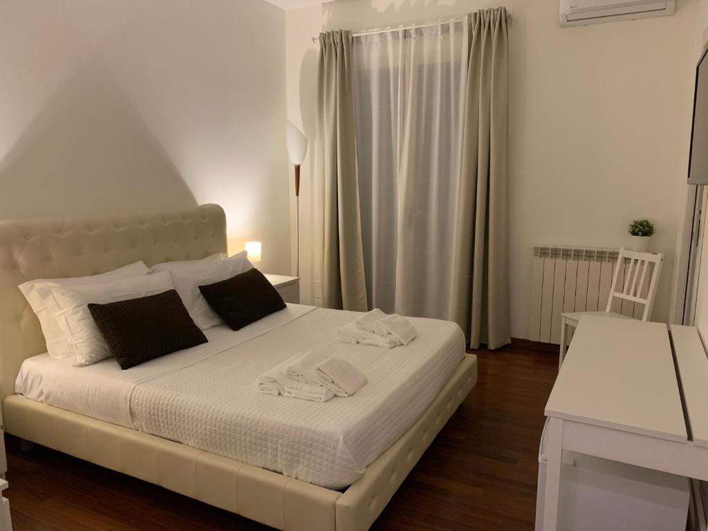 Postel nebo postele na pokoji v ubytování BeB L'ALLORO