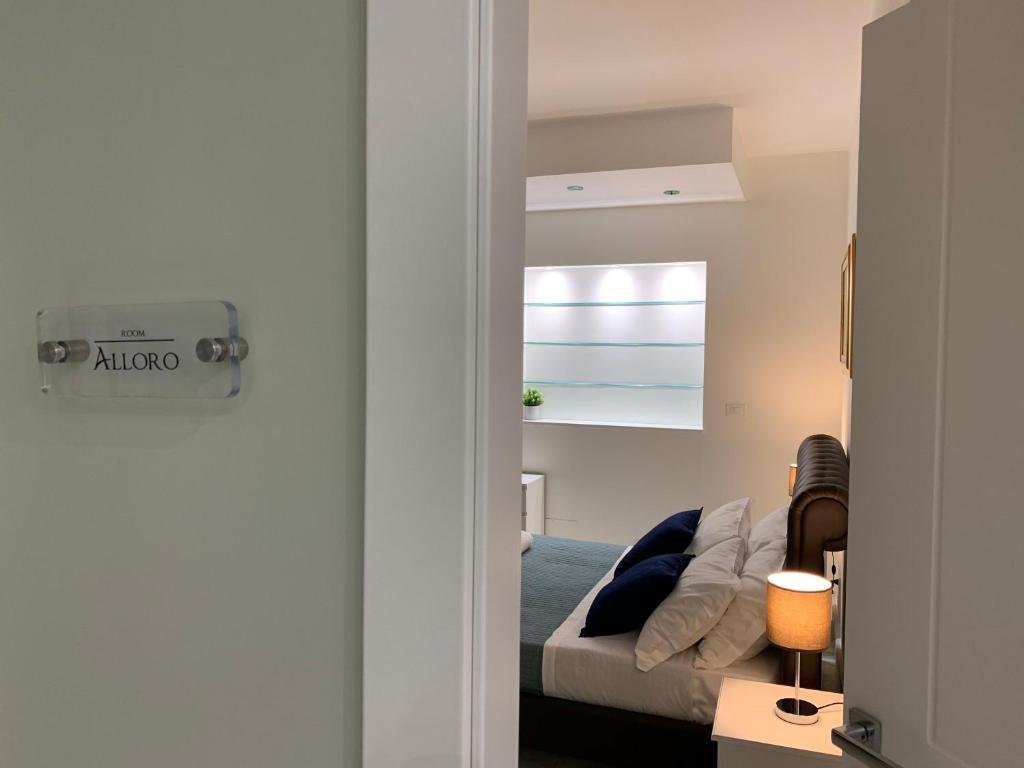 Postel nebo postele na pokoji v ubytování BeB L'ALLORO