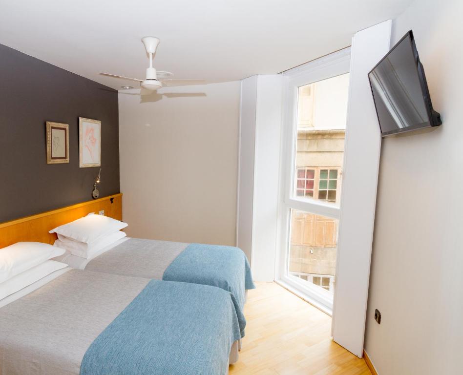 Posteľ alebo postele v izbe v ubytovaní Hotel Zarampallo