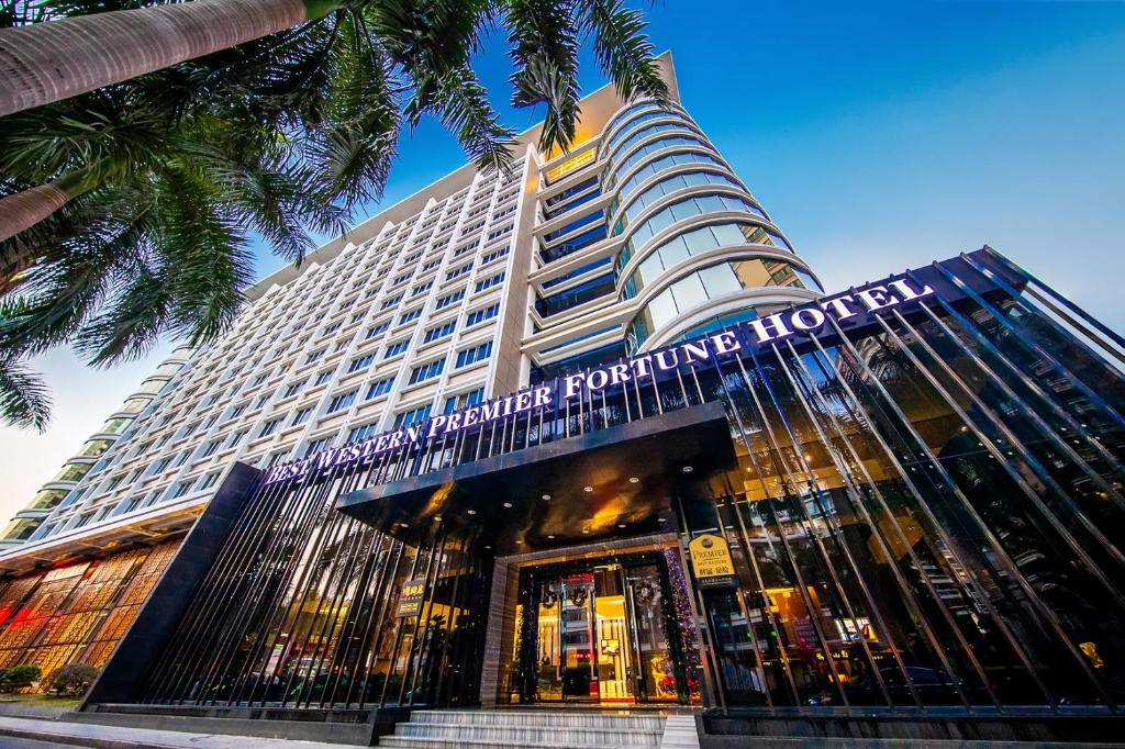 a tall building with a sign on the front of it at Fortune Hotel Fuzhou in Fuzhou