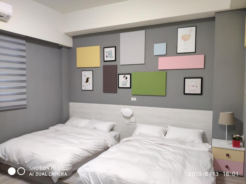 Postel nebo postele na pokoji v ubytování WT BnB Taichung
