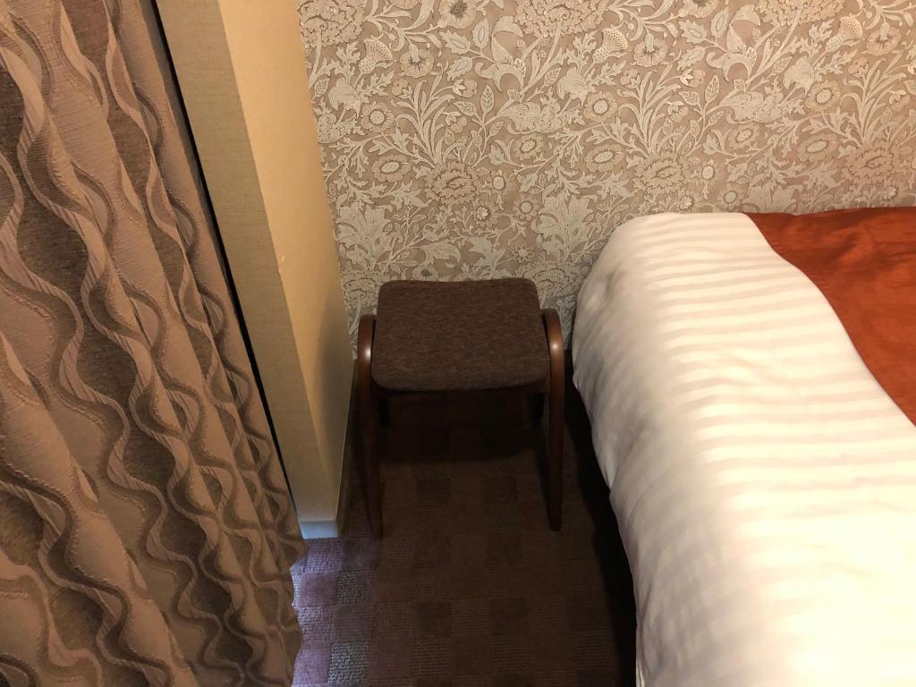 Postel nebo postele na pokoji v ubytování Hotel Patio Dogo