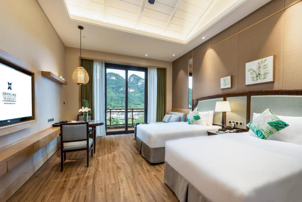 Postel nebo postele na pokoji v ubytování C&D Resort,Wuyi Mountain