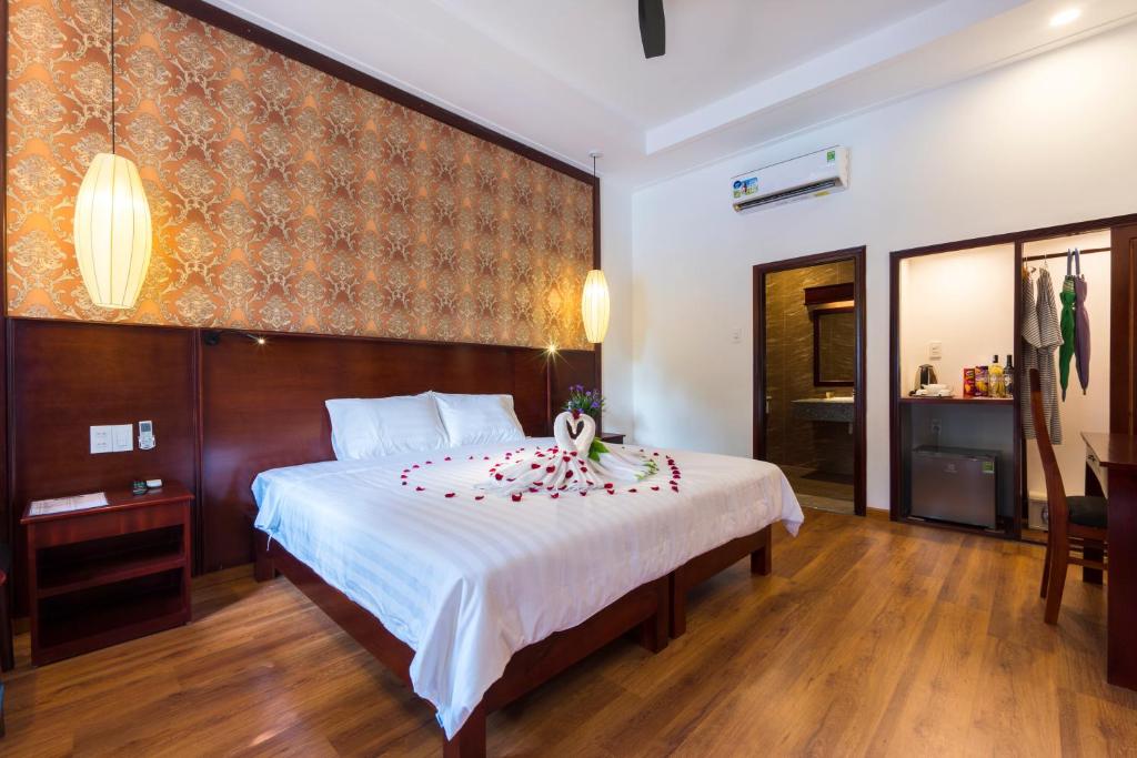 En eller flere senger på et rom på Phu Quoc Villa