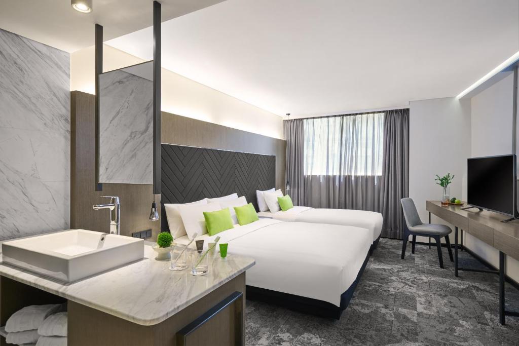 Postel nebo postele na pokoji v ubytování Hotel Ease Tsuen Wan