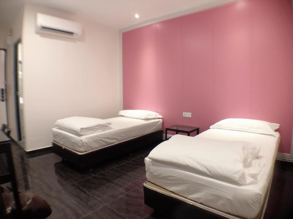 Postel nebo postele na pokoji v ubytování M Design Hotel @ Taman Pertama