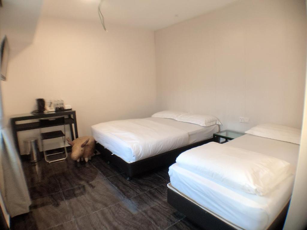 Postel nebo postele na pokoji v ubytování M Design Hotel @ Taman Pertama