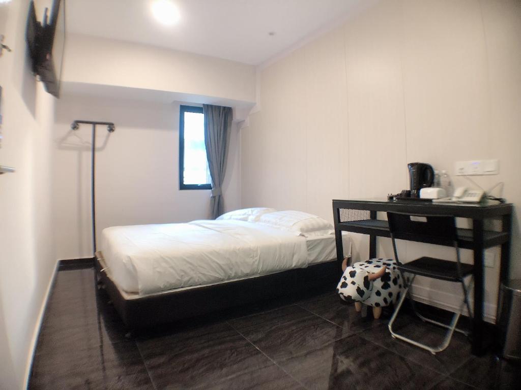 Postel nebo postele na pokoji v ubytování M Design Hotel @ Taman Pertama