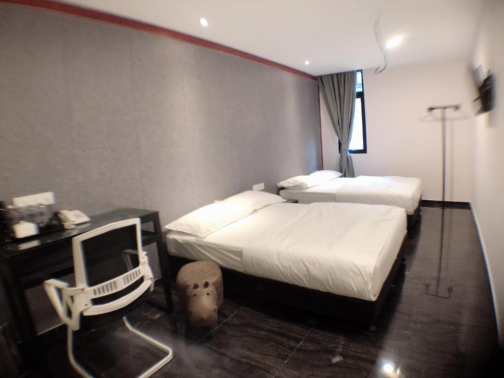 Postel nebo postele na pokoji v ubytování M Design Hotel @ Taman Pertama