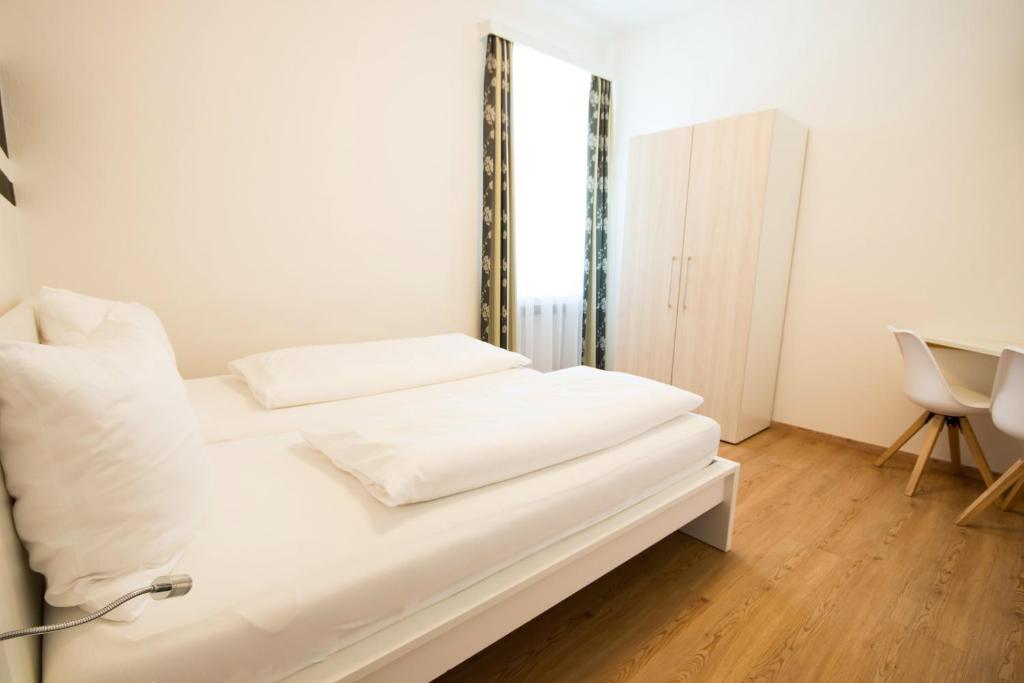 Postel nebo postele na pokoji v ubytování Pension Alte Mühle