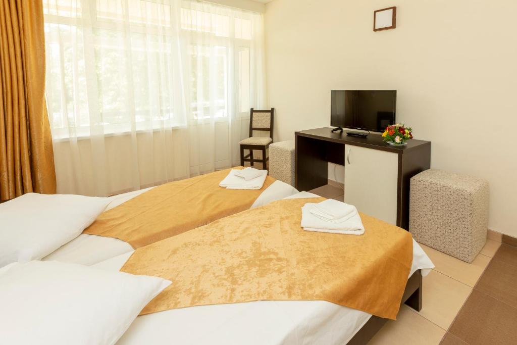 Postel nebo postele na pokoji v ubytování Hotel Dacia